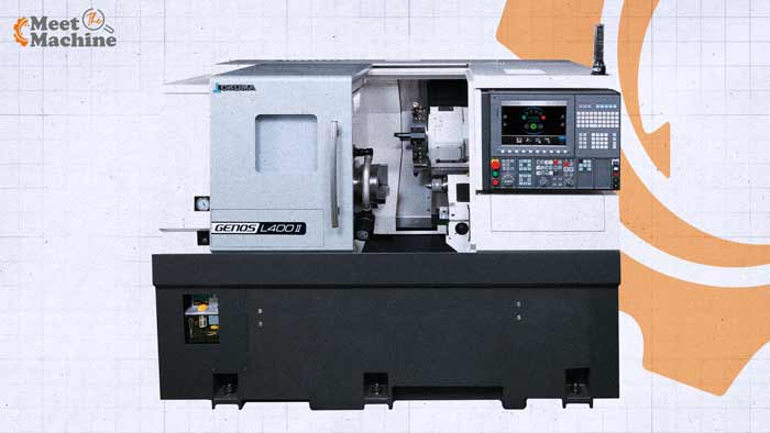 Okuma GENOS L400II CNC Lathe with the door open, showing the 3-jaw chuck, turret, tailstock and OSP control